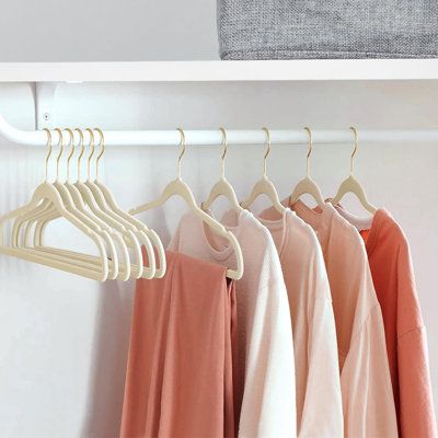 white velvet hangers in closet