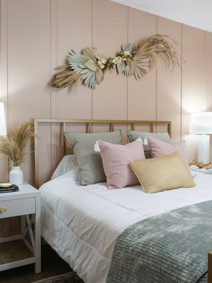 mix and match bedroom furniture ideas with gold metal bed frame white side table and cool peach accent wall