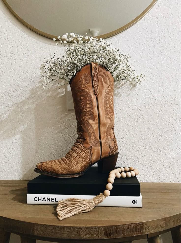 western boho living room decor cowgirl boot with plants inside